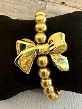 Large Gold tone Bow Bead Stretch Bracelet